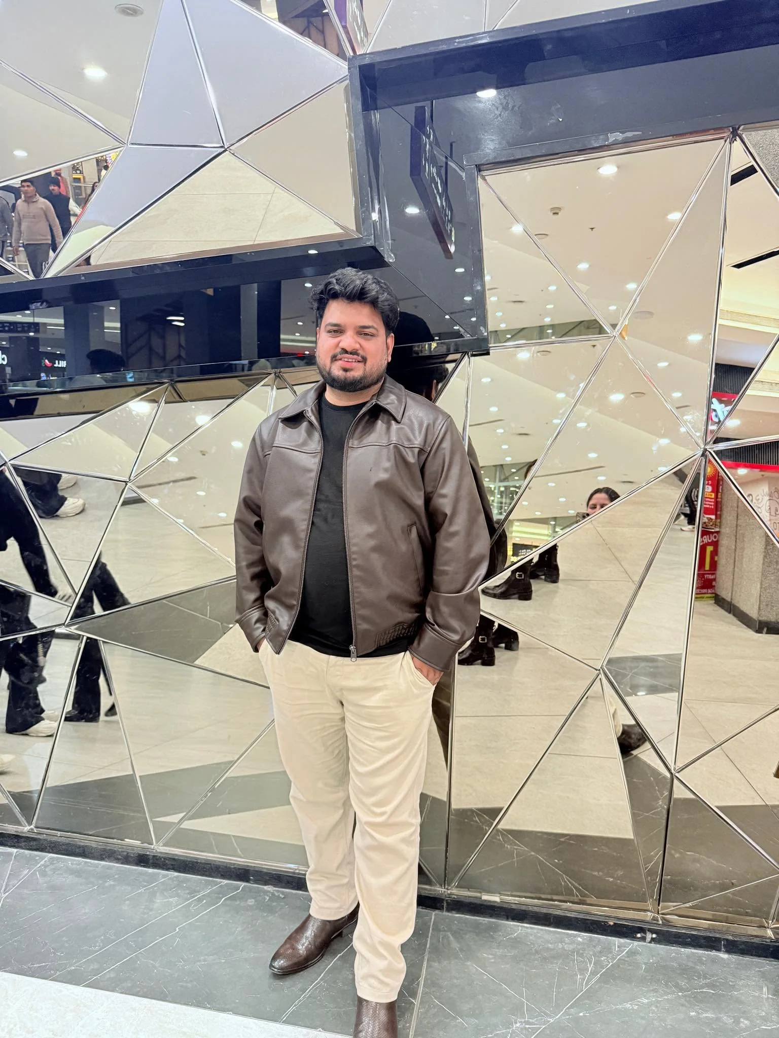 Mukesh Kumar in a brown jacket